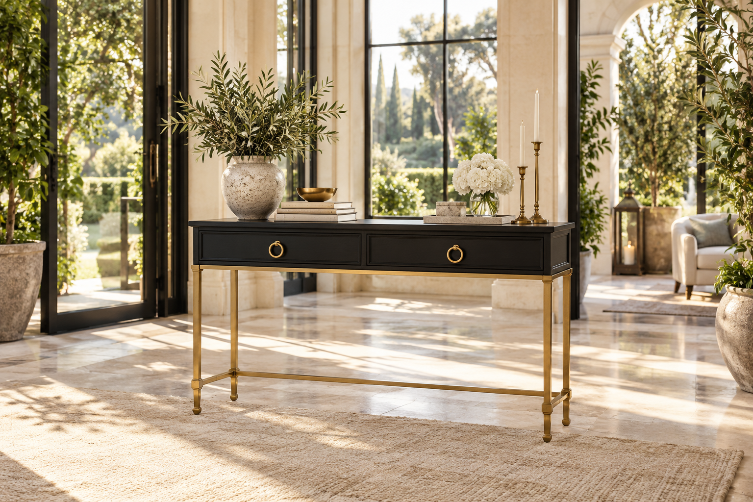 Black statement table with champagne-gold legs in an elegant atrium room